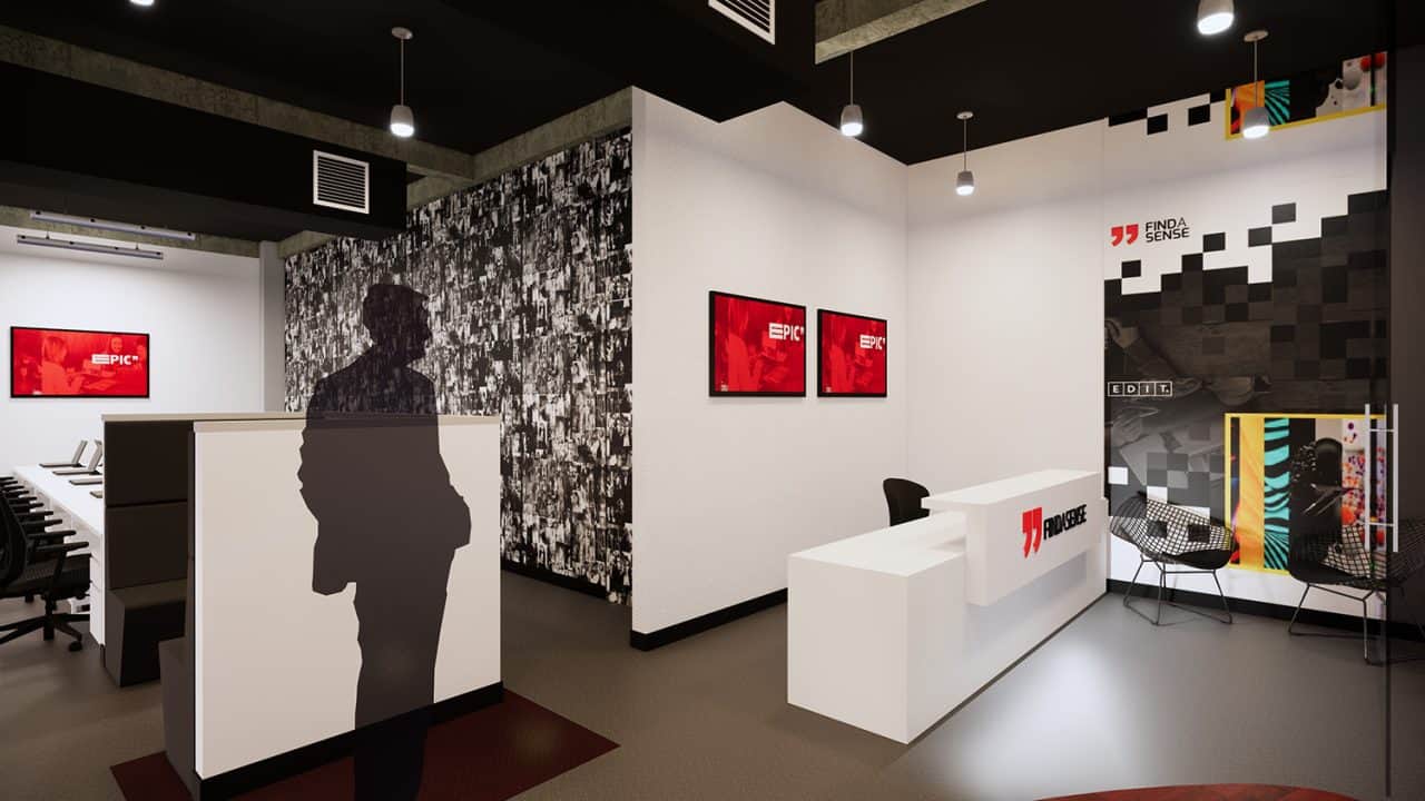 Interior de las oficinas Findasense, con espacios abiertos, salas informales y auditorio multifuncional para colaboración.