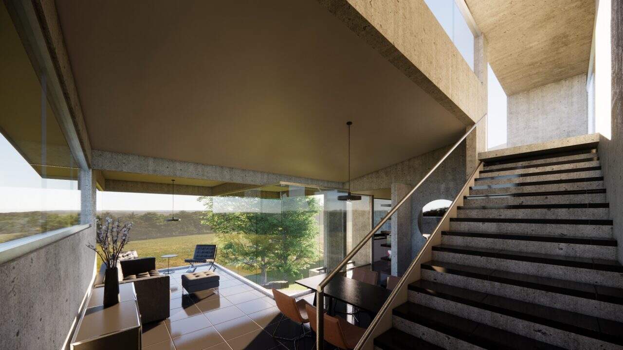 Vista de vivienda en pendiente con ventanales y conexión al bosque.