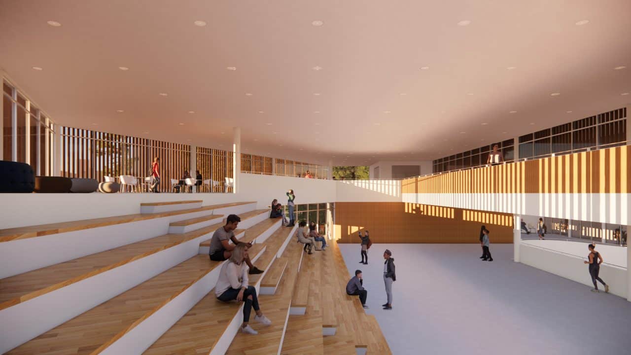 Vista del Colegio de Santiago en Cartago, integrado con el bosque y el paisaje agrícola circundante.