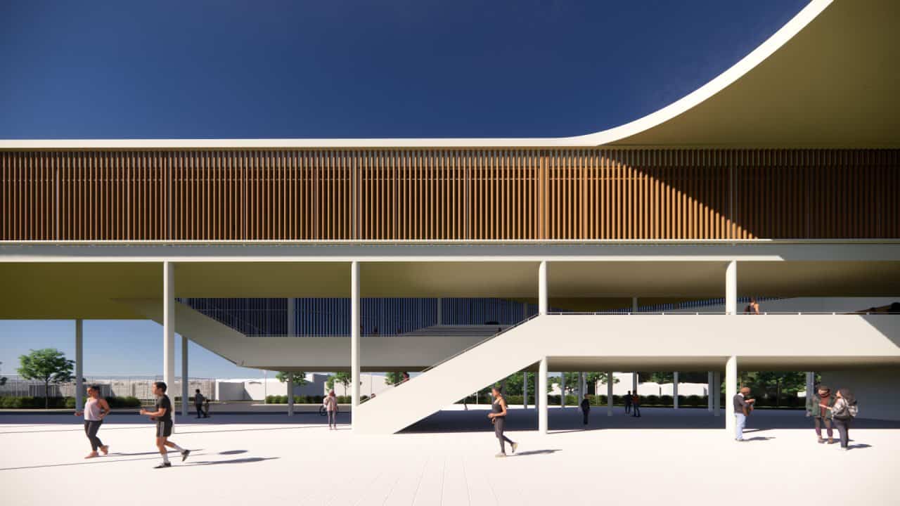 Vista del Colegio de Santiago en Cartago, integrado con el bosque y el paisaje agrícola circundante.