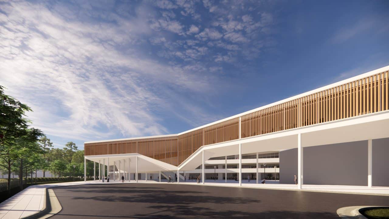 Vista del Colegio de Santiago en Cartago, integrado con el bosque y el paisaje agrícola circundante.