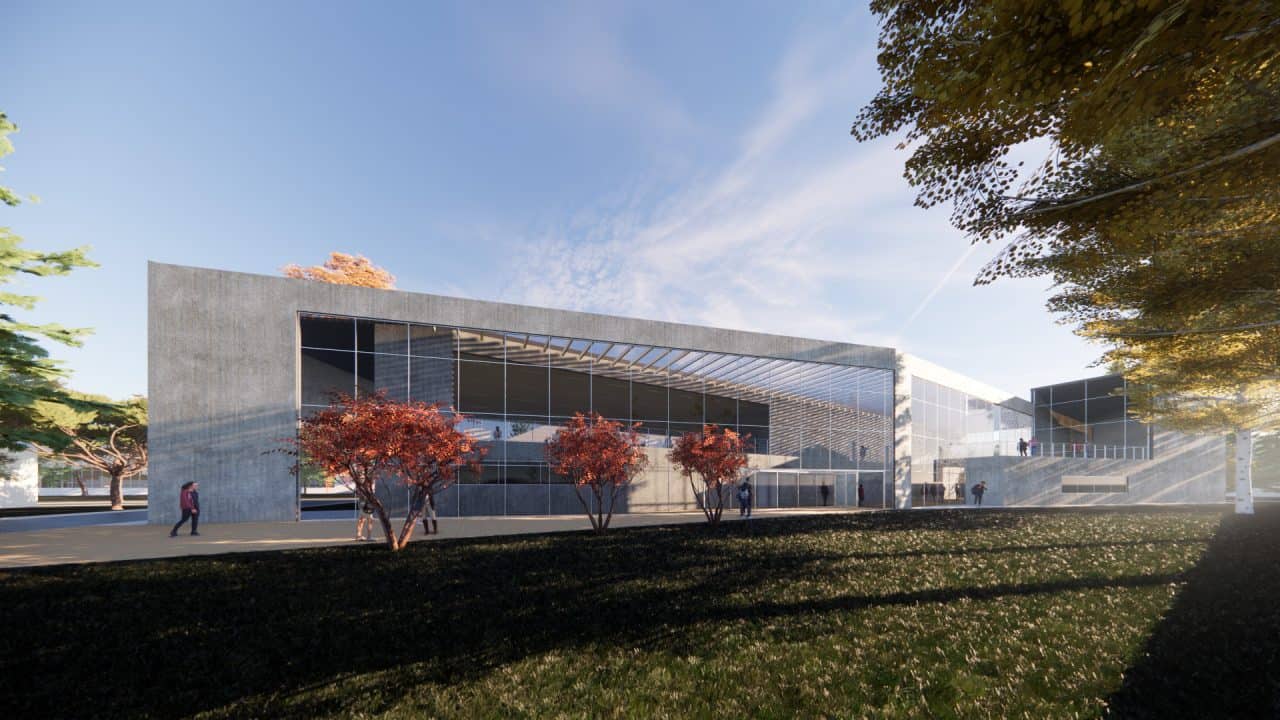 Vista interior del laboratorio experimental del Centro Atómico Bariloche con doble altura y luz natural.