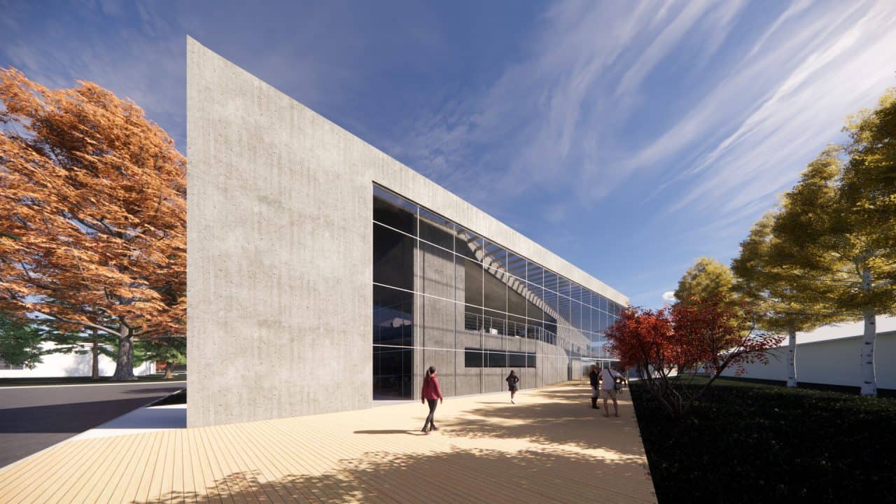 Vista interior del laboratorio experimental del Centro Atómico Bariloche con doble altura y luz natural.