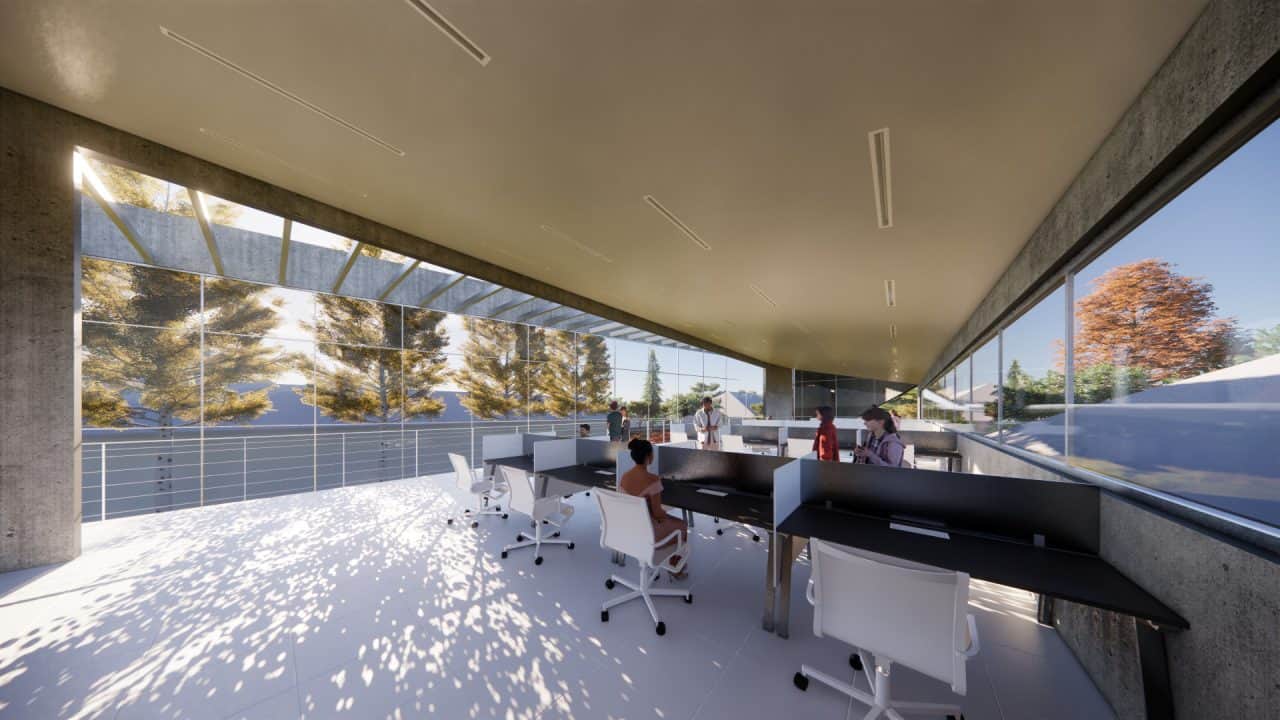 Vista interior del laboratorio experimental del Centro Atómico Bariloche con doble altura y luz natural.