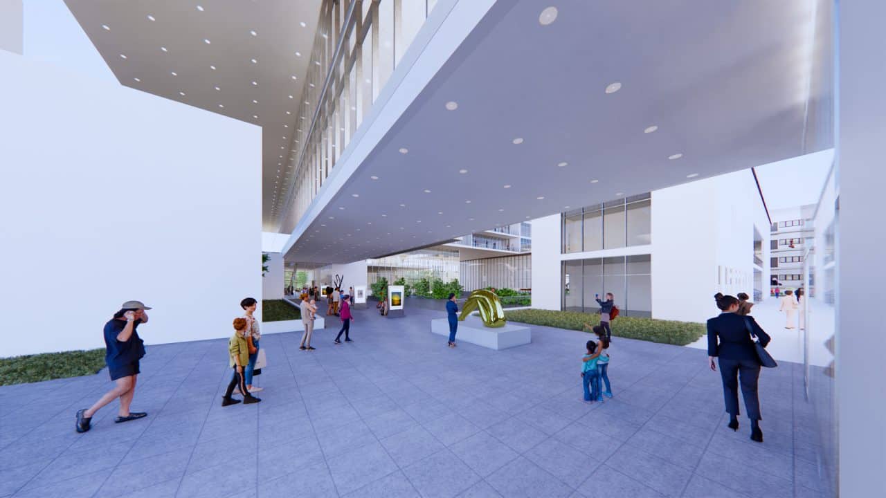 Vista del nuevo Edificio Municipal de Talca, con galería abierta, terraza pública y arquitectura integrada al paisaje urbano.