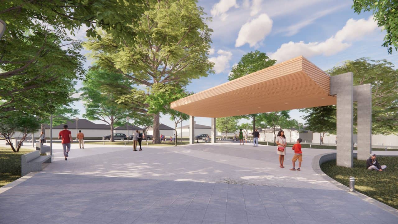 Vista del Parque Central Campo 5 con plaza, cancha cubierta y áreas verdes en la ruta a Tortuguero.