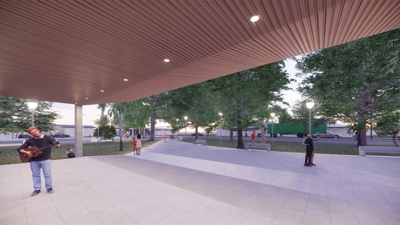 Vista del Parque Central Campo 5 con plaza, cancha cubierta y áreas verdes en la ruta a Tortuguero.