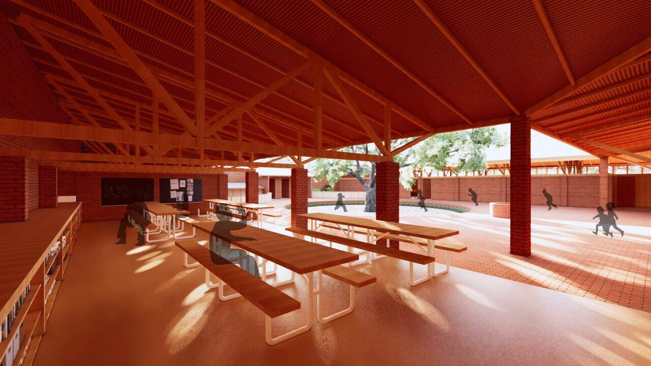 Vista de la Escuela Primaria de Marsassoum con patio central y árbol simbólico rodeado por aulas y espacios comunitarios.