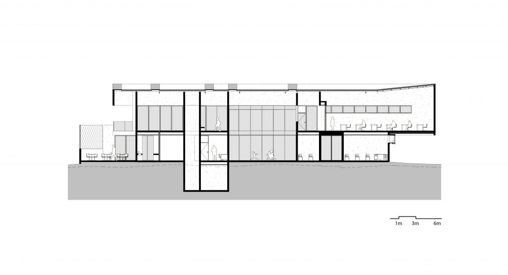 Centro de Desarrollo Humano de Tirrases, sección arquitectónica, tres niveles sobre la pendiente del terreno