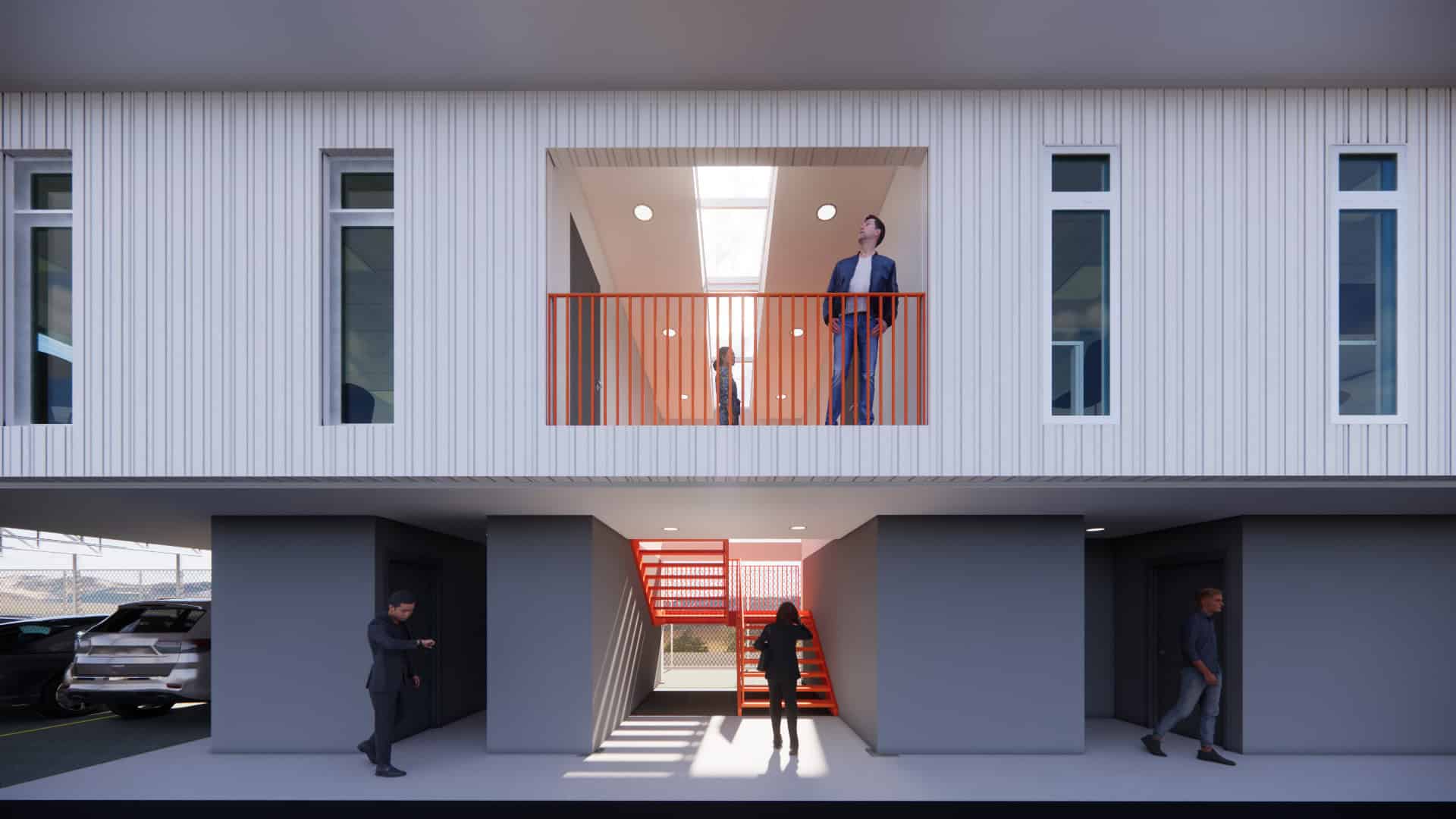 Vista del nuevo volumen en voladizo del plantel municipal de San Carlos con fachada sobria y escalera naranja.