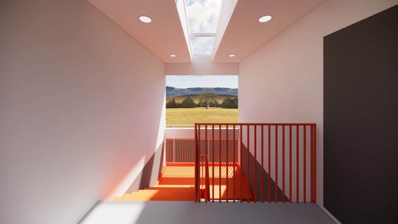 Vista del nuevo volumen en voladizo del plantel municipal de San Carlos con fachada sobria y escalera naranja.