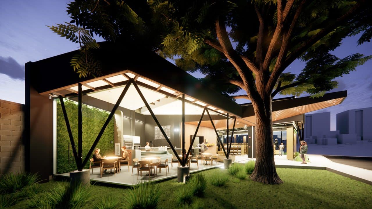 Tienda institucional con techo en forma de llama y cafetería junto a un árbol integrado al diseño.