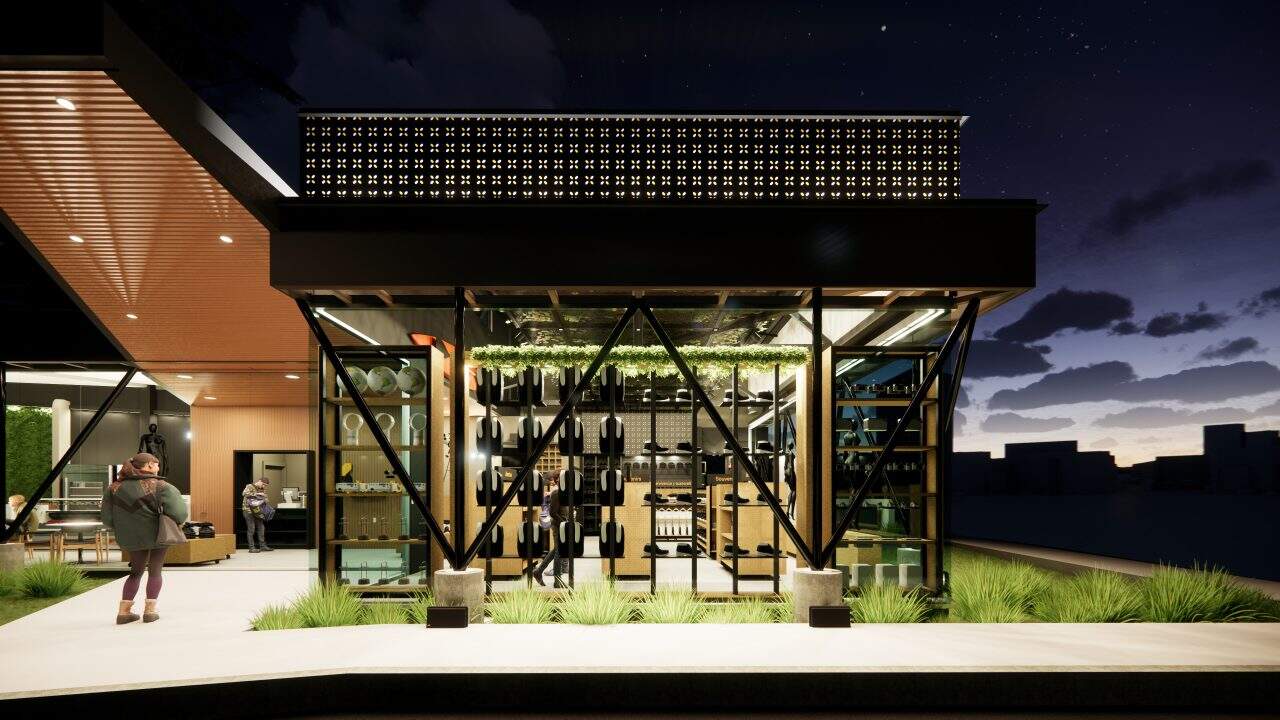 Tienda institucional con techo en forma de llama y cafetería junto a un árbol integrado al diseño.