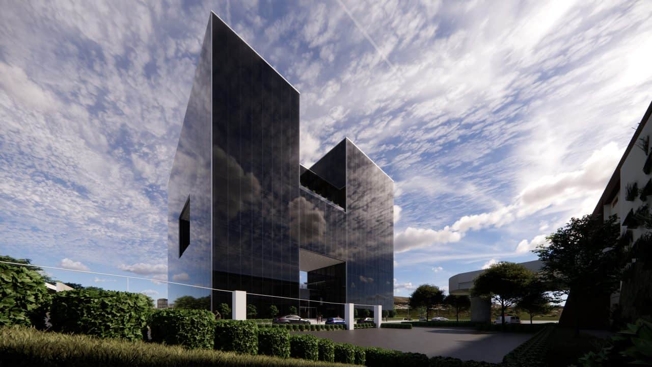 Vista del edificio triangular en el Valle Central con terrazas y fachadas de vidrio.