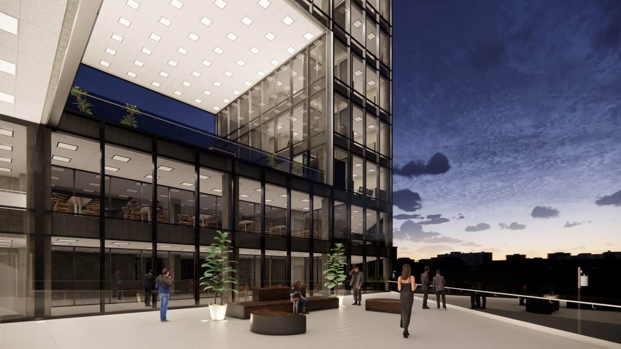 Vista del edificio triangular en el Valle Central con terrazas y fachadas de vidrio.