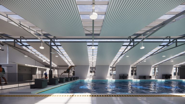 Vista de las piscinas recreativas renovadas en Goicoechea con áreas verdes y plaza peatonal