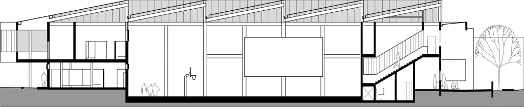 Centro Comunitario El Tirrá, gym section, sawtooth roof and bleachers